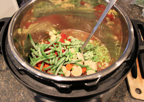 Beef vegetable stew ingredients in instant pot before cooking