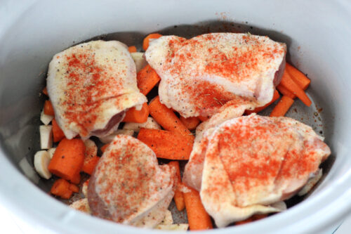 chicken thighs with carrots and parsnips in a slow cooker