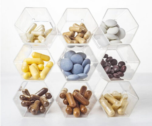 hexagon shaped containers filled with various supplements