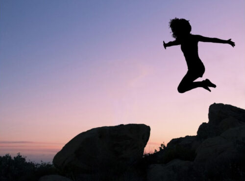 Silhouette of girl jumping
