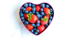 Heart shaped bowl filled with berries